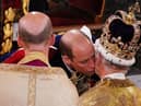  Prince William kisses his father, Britain’s King Charles III as he pays homage (Photo: Getty Images)