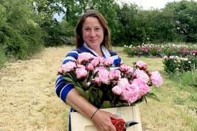 Elonor Tivey at her seven acre field in Leicestershire where she farms peonies. 