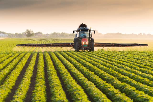 A toddler died after being hit by a tractor in Devon