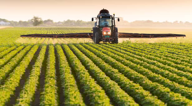 A toddler died after being hit by a tractor in Devon