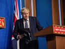 Boris Johnson to stick with ‘Plan B’ Covid measures despite mounting pressures (Photo by JACK HILL/POOL/AFP via Getty Images)
