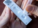A lateral flow test result is interpreted by the two letters on the device (Photo: Shutterstock)