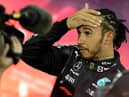 Second-placed Mercedes' British driver Lewis Hamilton reacts in the parc ferme of the Yas Marina Circuit after the Abu Dhabi Formula One Grand Prix on December 12, 2021 (Getty Images)