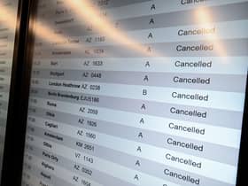 A screen shows cancelled flights at Milan Linate Airport in Milan, Italy on October 21, 2022 due to strike (Photo by Piero Cruciatti/Anadolu Agency via Getty Images)