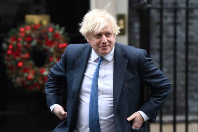 Boris Johnson faces a major Tory rebellion over the new rules in the Commons next week, although the measures are expected to pass (image: AFP/Getty Images)