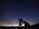 Members of the York Astronomical Society prepare to view the annual Perseids meteor shower in the village of Rufforth, near York, in August 2015 (Photo: OLI SCARFF/AFP via Getty Images)