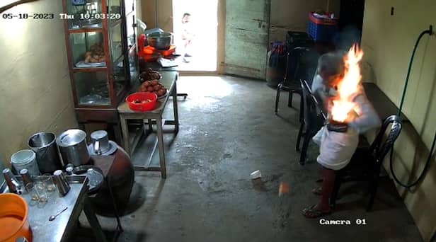 CCTV footage shows the moment a man’s phone bursts into flames in his pocket 