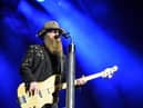 Dusty Hill, bassist of American rock-blues band ZZ Top, has died at the age of 72, his band members have announced (Photo: SEBASTIEN BOZON/AFP via Getty Images)