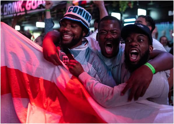 England fans cheer as they watch a live broadcast of the semi-final match between England and Denmark (Getty Images)