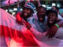 England fans cheer as they watch a live broadcast of the semi-final match between England and Denmark  (Getty Images)
