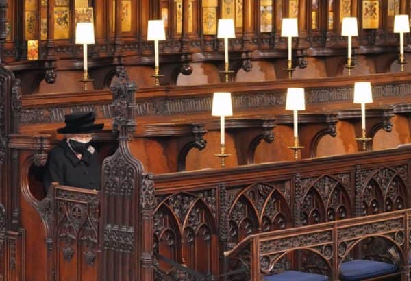 Cutting a solitary figure at the front of the quire, nearest the altar, the Queen sat apart from her children