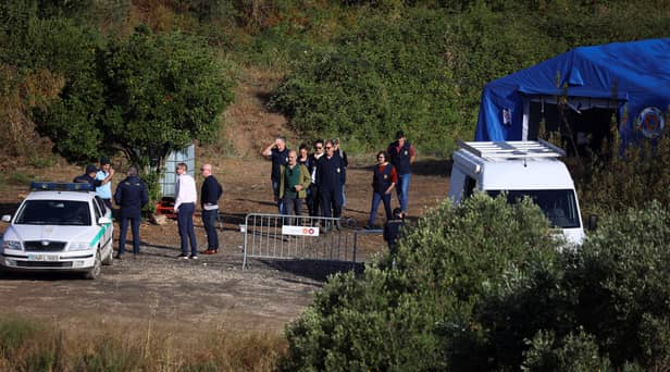Portuguese Judicial Police criminal investigation unit members prepare at the base camp near the Arade dam, in Silves, on 24 May, 2023 on the second day of a new search operation amid the investigation into the disappearance of Madeleine McCann. (Photo by FILIPE AMORIM / AFP) (Photo by FILIPE AMORIM/AFP via Getty Images)