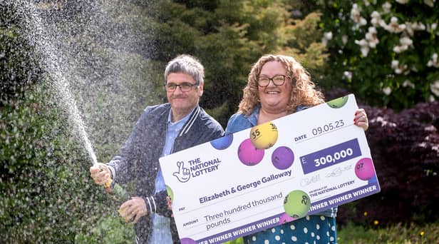 National Lottery winners Liz and George Galloway celebrate after winning Â£300,000 on the National Lottery Bingo Bonus Scratch card in Glasgow. (Photo: Anthony Devlin)