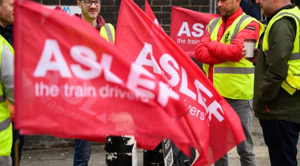 LONDON, ENGLAND - MAY 31: A group of rail workers stand on a picket line outside Euston rail station as a new round of strikes by train drivers begins on May 31, 2023 in London, England. Today's strike comes after the train drivers union, ASLEF, rejected a pay rise offer of 4 percent a year over two years from the Rail Delivery Group (RDG). (Photo by Leon Neal/Getty Images)