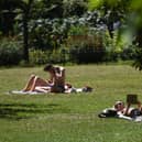 Sunbathers in St James’ Park, London.