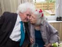 Joan Neininger & Ken Selway share a kiss at their wedding reception at Hannover Court, Cinderford, Gloucestershire. 