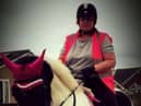 Michelle Hanney pictured riding a horse. (DWP/SWNS)