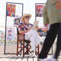 Jim Moir illustrates members of the public at the seaside