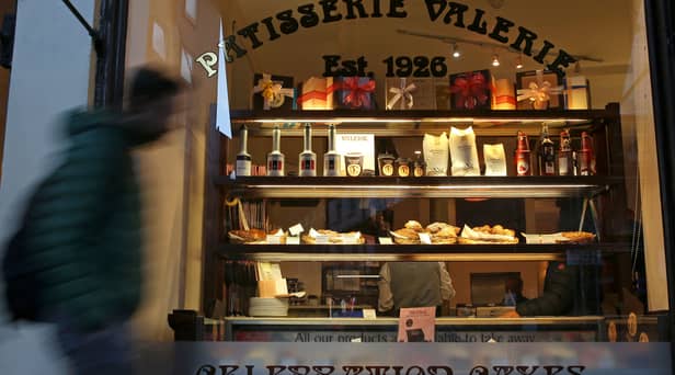 A pedestrian walks past a branch of a Patisserie Valerie cafe in London on January 23, 2019.
