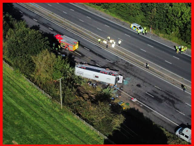 Emergency services at the scene of a coach crash on the M53 motorway, between junction 5 at Ellesmere Port and junction 4 at Bebbington. 