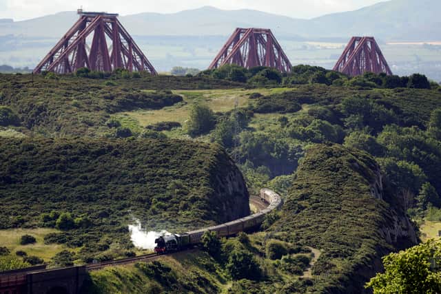 The Flying Scotsman locomotive crosses the Forth Bridge, as it makes a journey to Aberdeen during the steam train's centenary tour on July 03, 2023 in Edinburgh. (Photo by Jeff J Mitchell/Getty Images)