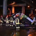 Firefighters work on the site of a bus accident on 3 October in Mestre, near Venice (Photo: MARCO SABADIN/AFP via Getty Images)