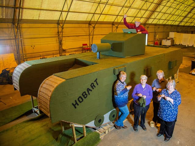(L to R) Lynn Hart, Hazel Barker, Carol Dunkley, Sandra Searle and Stuart Martin beside the knitted tank.