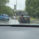 Sofa flies off roof of car and onto busy roundabout.