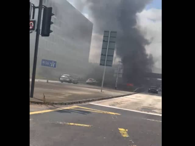 Thick plumes of black smoke covered the area after the car caught fire -Credit:Rick Bache/Facebook