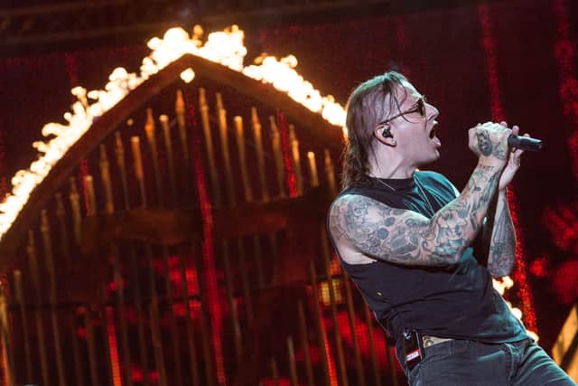 M. Shadows of American heavy metal band Avenged Sevenfold performs during the final day of the Rock in Rio music festival in Rio de Janeiro, Brazil, on September 22, 2013. (AFP PHOTO / YASUYOSHI CHIBA)