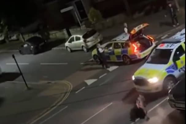 A still from a video uploaded by X account UB1UB2 West London (Southall) of a cow being rammed by a police car in Feltham on June 14, 2024 
