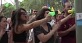 Anti-mass-tourism protesters squirt diners with water guns in Barcelona, Spain.