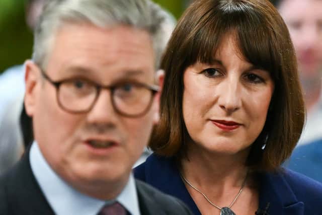 Rachel Reeves listens to Keir Starmer on the Labour general election campaign trail in May (Photo: JUSTIN TALLIS/AFP via Getty Images)