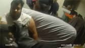 Police wake sleeping drug dealer to arrest him.