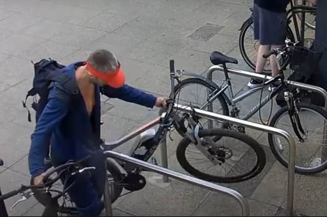 Brazen thief steals bike from outside supermarket.