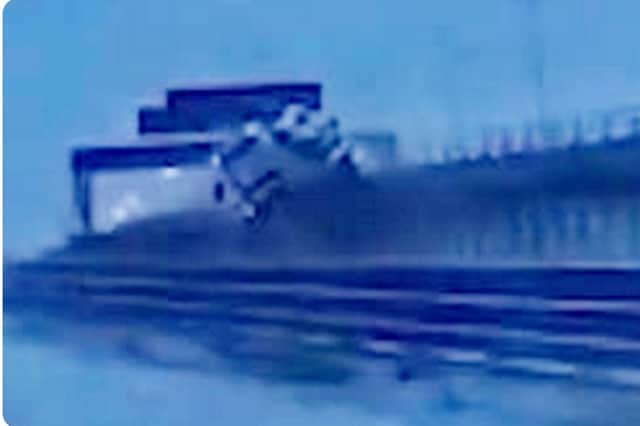 The video shows the lorry smashing through safety barriers on Thelwall Viaduct near Warrington before plummeting to scrubland below on Monday (September 30).