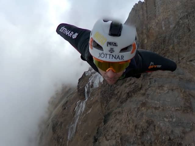 Wingsuit jumper Tim Howell leaps off Mount Kilimanjaro at 5,450m.