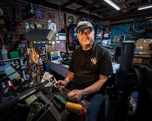Dr Pinball Mark Squires at his home in Swavesey, Cambridgeshire where he fixes and restores pinball machines.