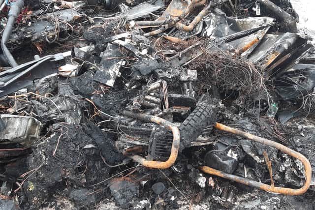 The remains of the e-bike in the debris