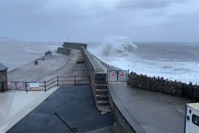 Huge waves crash into Porthcawl pier.