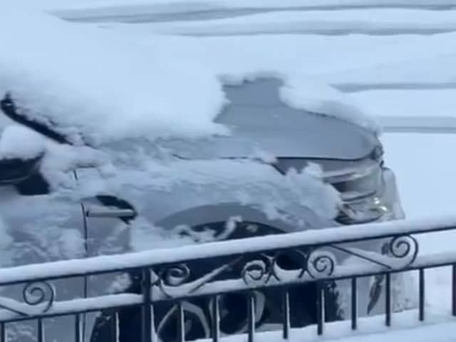 Snow coats roads in Anfield ahead of Liverpool vs Manchester United match.