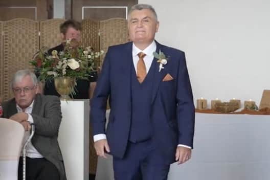 Neil Crossley walks down the aisle at his daughter's wedding, forgetting to take her with him, in Holmfirth, Yorkshire.