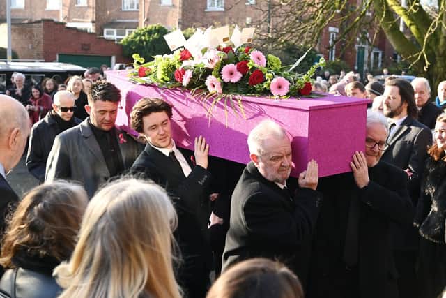 The singer’s pink sparkly coffin was carried from St Paul’s Church in Blackpool to applause from members of the public