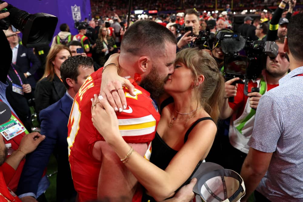 Will Travis Kelce propose to Taylor Swift during Superbowl Halftime? : Travis Kelce #87 of the Kansas City Chiefs and Taylor Swift embrace after defeating the San Francisco 49ers in overtime during Super Bowl LVIII at Allegiant Stadium on February 11, 2024 in Las Vegas, Nevada. Photo: Ezra Shaw/Getty Images