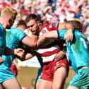 Kaide Ellis in action for Wigan Warriors against Huddersfield Giants