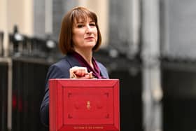 Rachel Reeves, poses with the red Budget Box as she leaves 11 Downing Street to present the government's annual budget to Parliament in October 2024.
