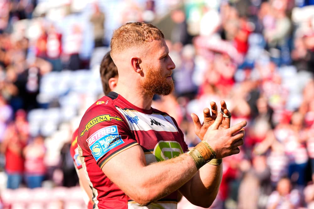 Luke Thompson of Wigan Warriors applauds the supporters