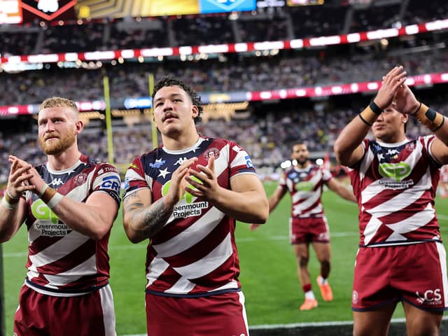 From left to right: Luke Thompson, Tyler Dupree and Patrick Mago applaud the Wigan Warriors supporters in Las Vegas