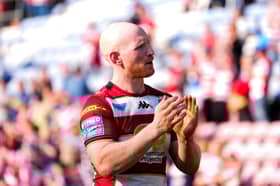 Liam Farrell applauds the Wigan Warriors fans