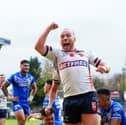 Wigan Warriors star Liam Marshall celebrating a try on his England debut